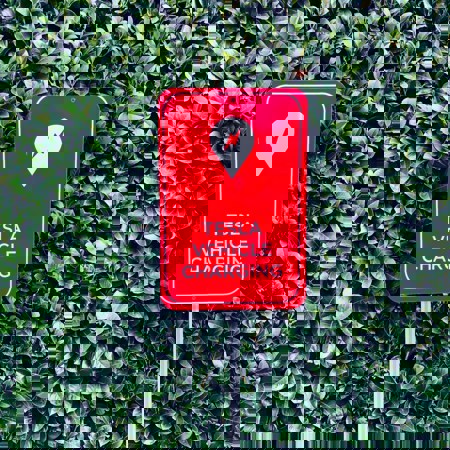 Tesla Vehicle Charging Station Sign Photo by John Cameron