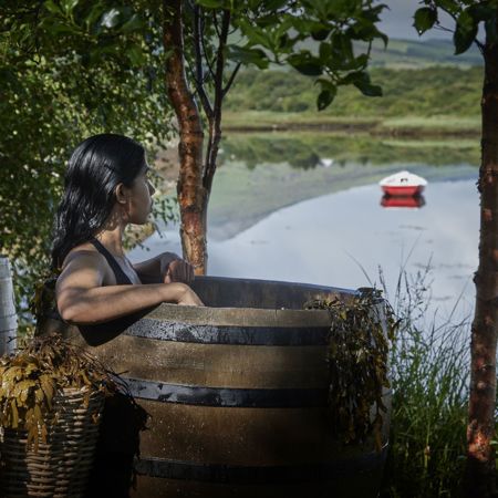 Lady sitting in a Barrel