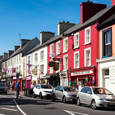 Kenmare town centre with its brightly painted buildings, including the "Kenmare Gift Store"